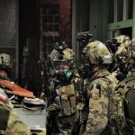 Operators of JW Formoza during the CQB exercise, wearing Ops-Core® FAST Covers in MultiCam®.